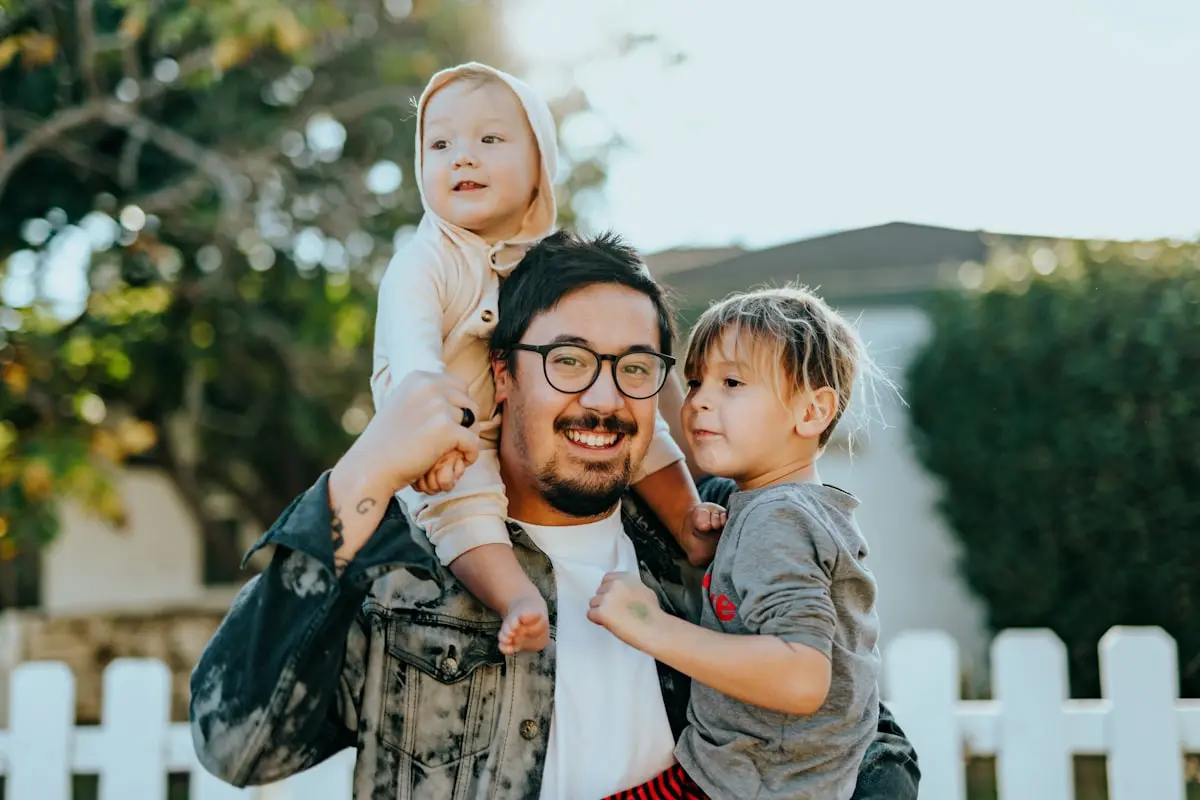Happy healthy family outdoors — natural family wellness lifestyle